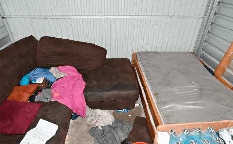 messy area with sectional and mattress without sheetz